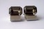 3240 c. 1960s Dante silver tone wrap around cufflinks. Faceted smoky quartz (I believe) center. Medium size, face of cufflink measures approx. ¾” x ½”, like new. Price: $35